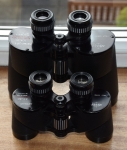5. Depth of field Comparing two binoculars, an 8 x 30 and a 10 x 50, the “in focus” depth of field will most likely be greater in the binoculars with smaller object glasses. The mechanism here is much the same as comparing the depth of field when having ones camera set at f 8 and f 4, where the setting is f8 more of the view will appear to be in focus. However when observing with one’s eyes as opposed to a camera chip, we have the ability to apply our eye’s focusing mechanism to the binoculars scene thereby giving a greater perceived depth of field. We have to consider too, the variable diameter of our eye pupil compared to the fixed diameter of the binoculars exit pupil. If the view is sunny our eye pupil may well be half the diameter of a 7x50’s 7mm exit pupil.This will effectively “stop down” the binoculars’ apertures thereby the depth of field will appear greater. Lower magnification will also increase the depth of field.On a bright day, my 7x50 Fujinon seems to focus from infinity to about 100ft. It’s is only when focusing closer that the reduced depth of field starts to become noticeable. At around 20 feet or less one really needs to have one finger on the focus wheel all the time to follow the movement of birds around the feeders. Newport and Apollo shown here to give some idea of size difference.