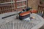 This .177 air rifle is just so polite . It is easy to cock and load with a soft rustle of positive latching precision clicks..The semi matt varnished beech-wood stock, responded to burnishing with car wax to a guitar like polished finish. With the Sidewinder scope and it's 30mm DM70 Dampa mount, it does weigh 12.5 pounds but it is a delight to shoot. Very accurate if shot right .with AA Diabolo fields 4.52. DSC_0494 Walther on sand bag 2.jpg